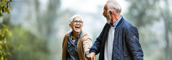 Chiropractic Reno NV Active Senior Couple Smiling A happy couple outside in jackets.